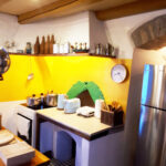Kitchen-Cooking-area-with-electric-stove-and-old-furnace pg